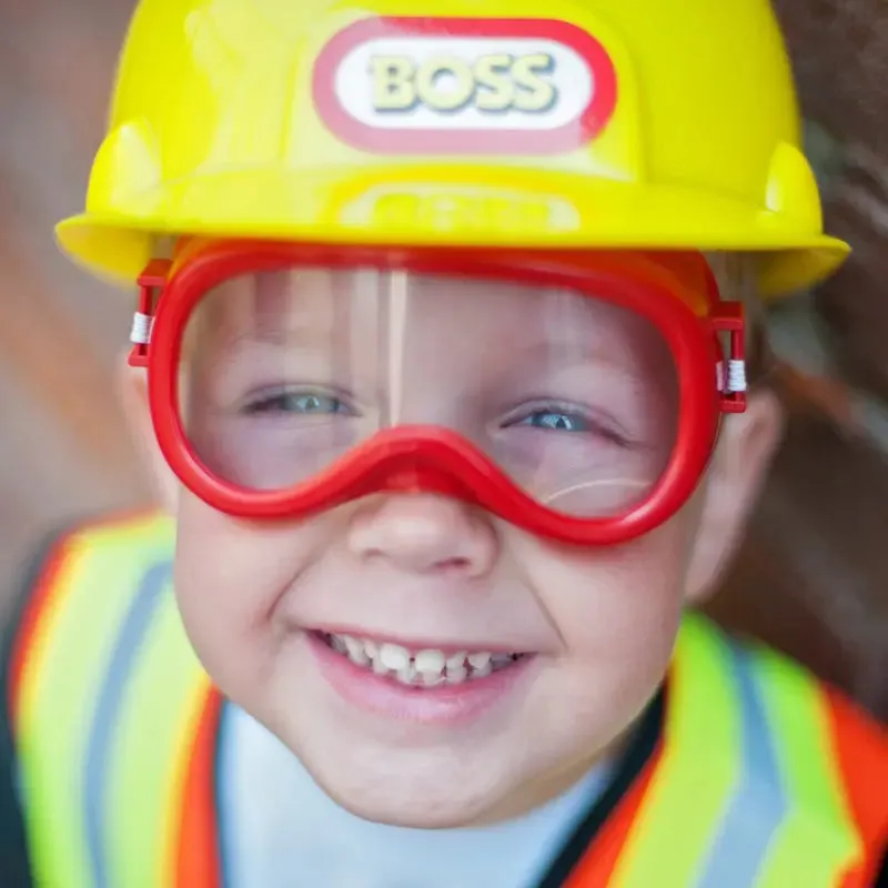CONSTRUCTION WORKER WITH ACCESSORIES IN GARMENT BAG